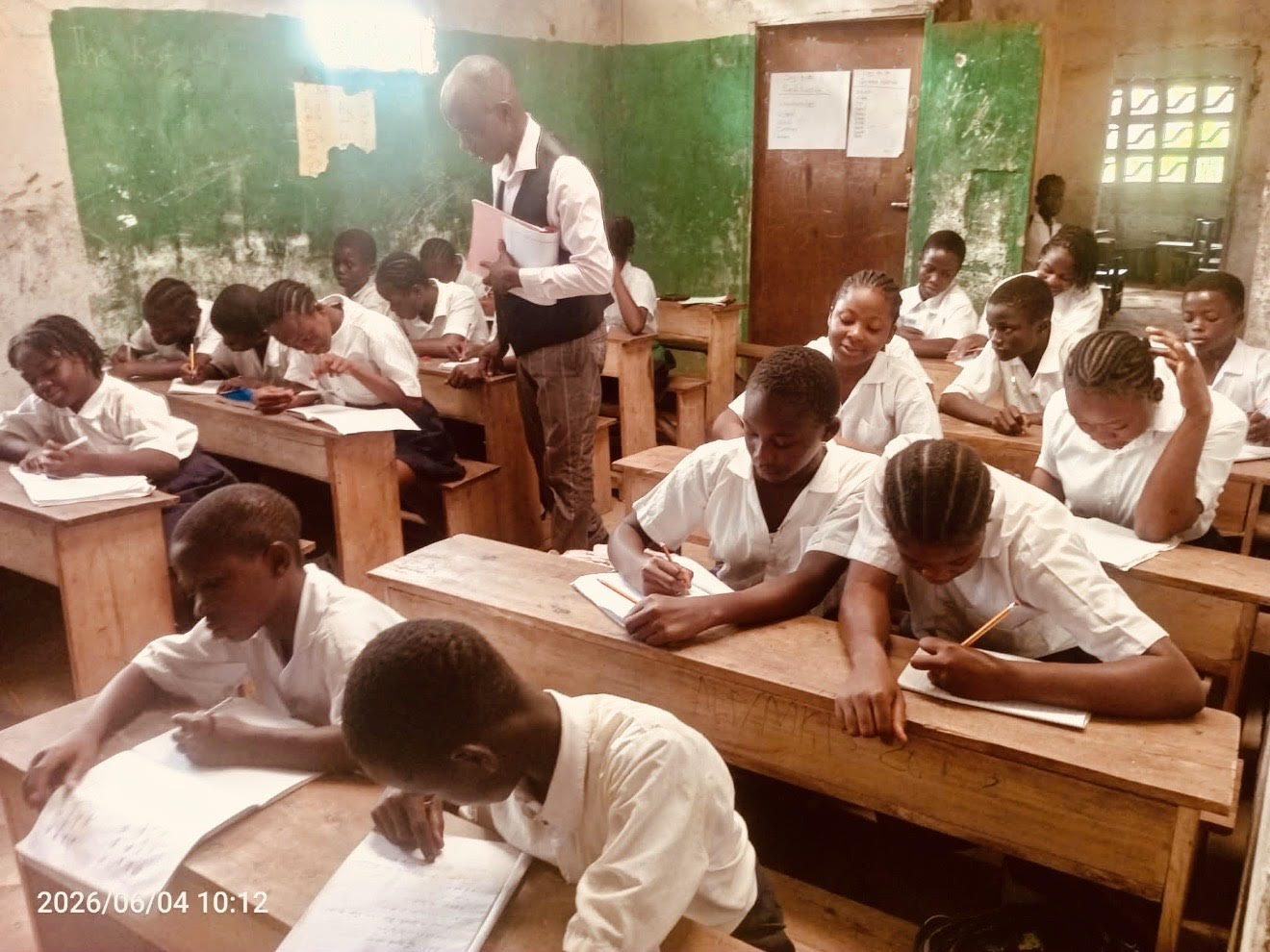 Joshua Boimah teaching students in his classroom in Liberia